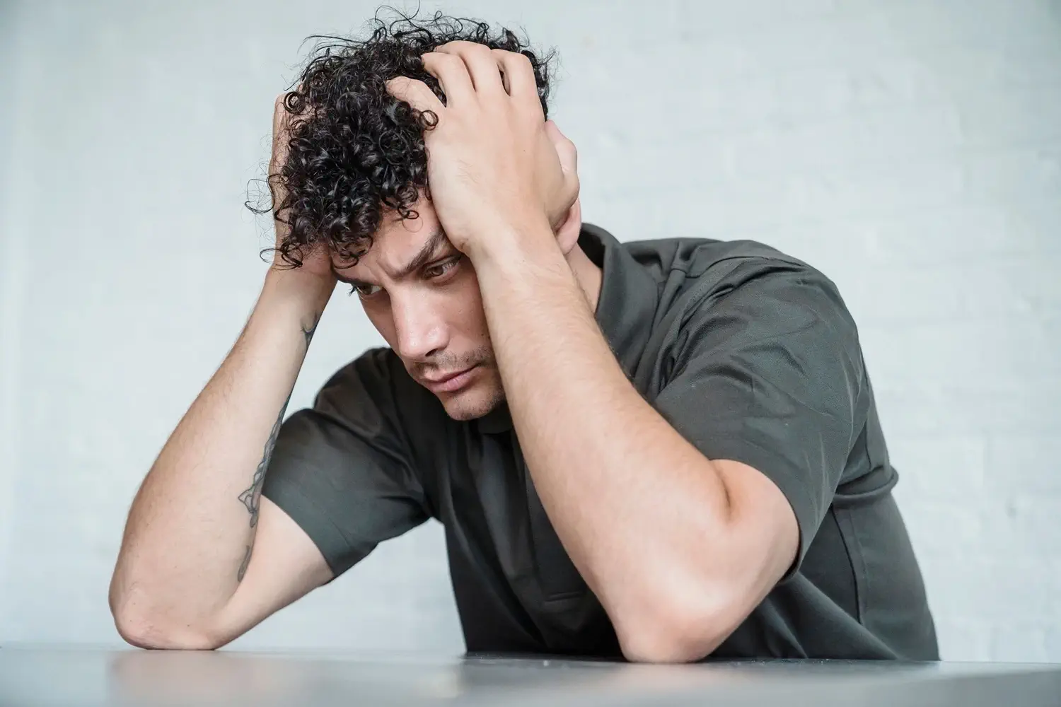 Man with head in hands